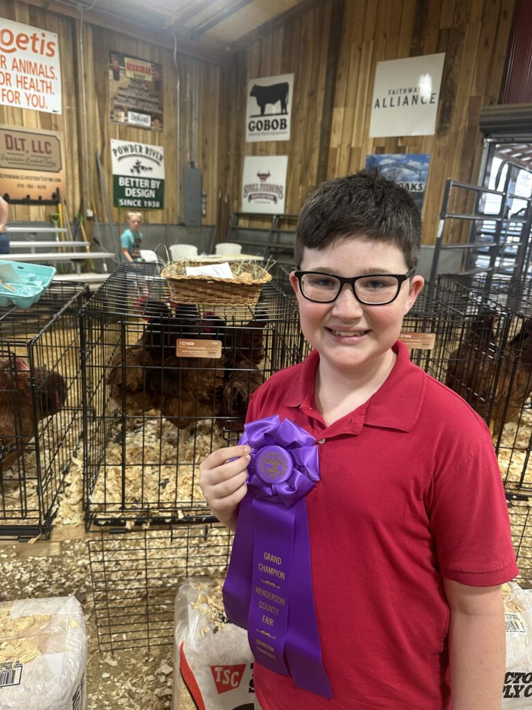 Griffin Brigance with his Champion winning Production Red hens last in 2024.